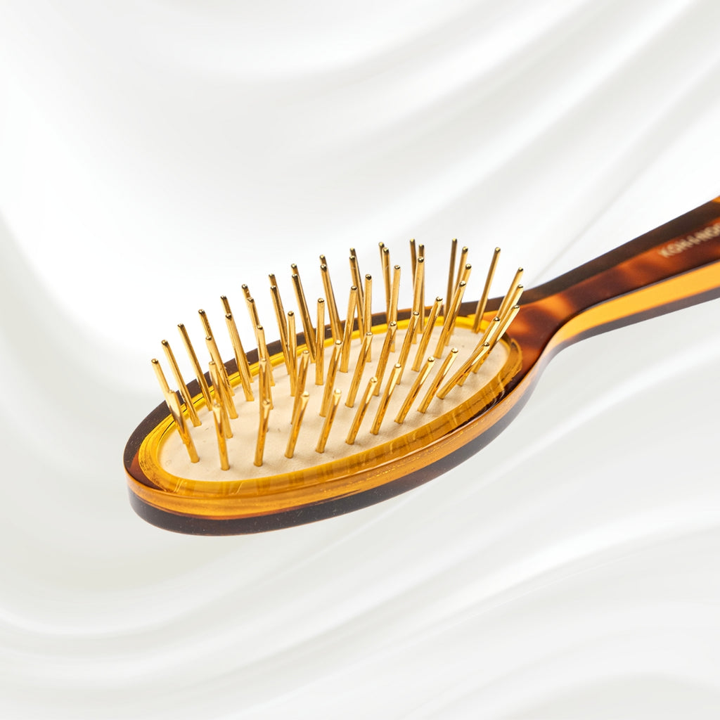 107G KOH-I-NOOR Jaspe small oval hairbrush with brown tortoiseshell acetate handle, and gold pins; KOH-I-NOOR's gold logo stamped on the handle