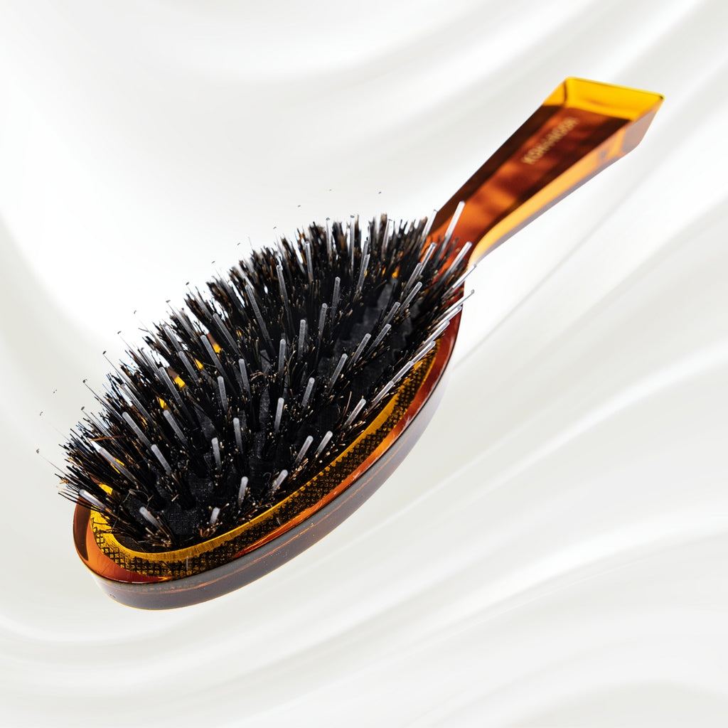 120 KOH-I-NOOR Jaspe small oval hairbrush with brown tortoiseshell acetate handle, black boar bristles and nylon pins; KOH-I-NOOR's gold logo stamped on the handle