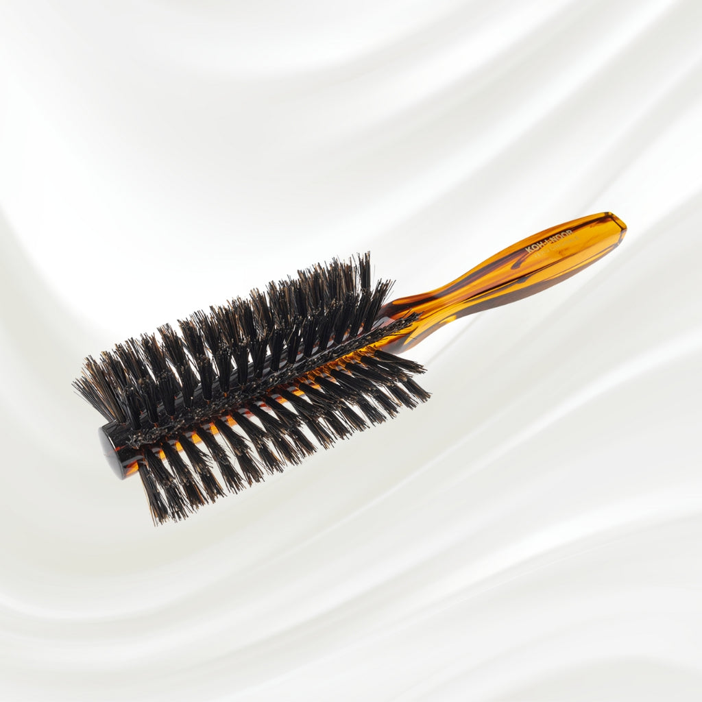 123 KOH-I-NOOR round styling hairbrush with brown tortoiseshell acetate handle and black boar bristles; KOH-I-NOOR's gold logo stamped on the handle