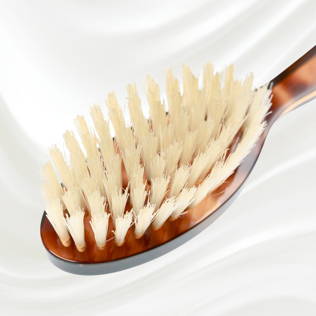203B KOH-I-NOOR small oval hairbrush with brown tortoiseshell acetate handle and white natural bristles; KOH-I-NOOR's gold logo stamped on the handle