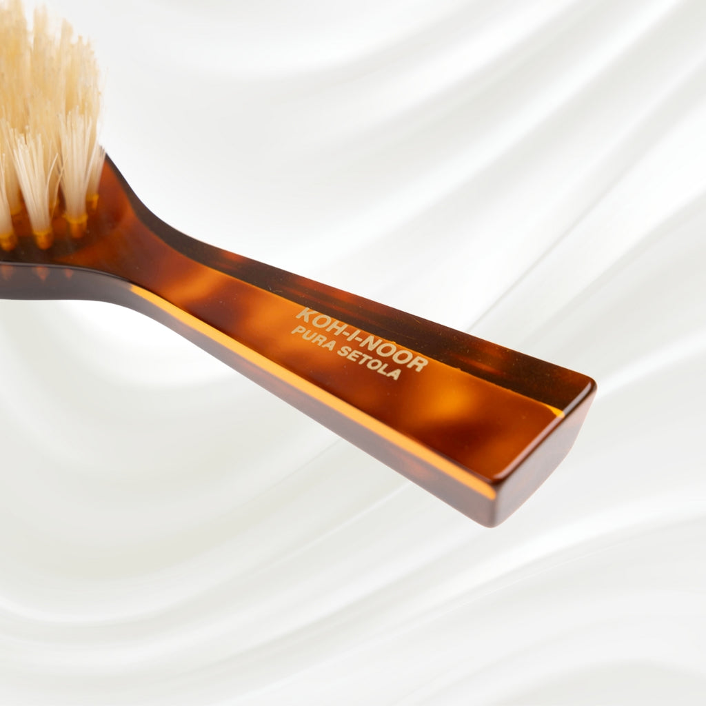 203B KOH-I-NOOR small oval hairbrush with brown tortoiseshell acetate handle and white natural bristles; KOH-I-NOOR's gold logo stamped on the handle