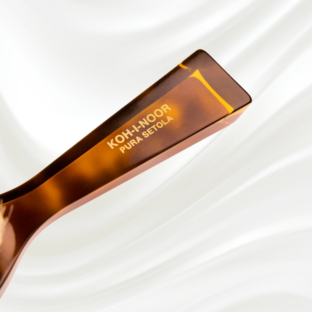 203B KOH-I-NOOR small oval hairbrush with brown tortoiseshell acetate handle and white natural bristles; KOH-I-NOOR's gold logo stamped on the handle