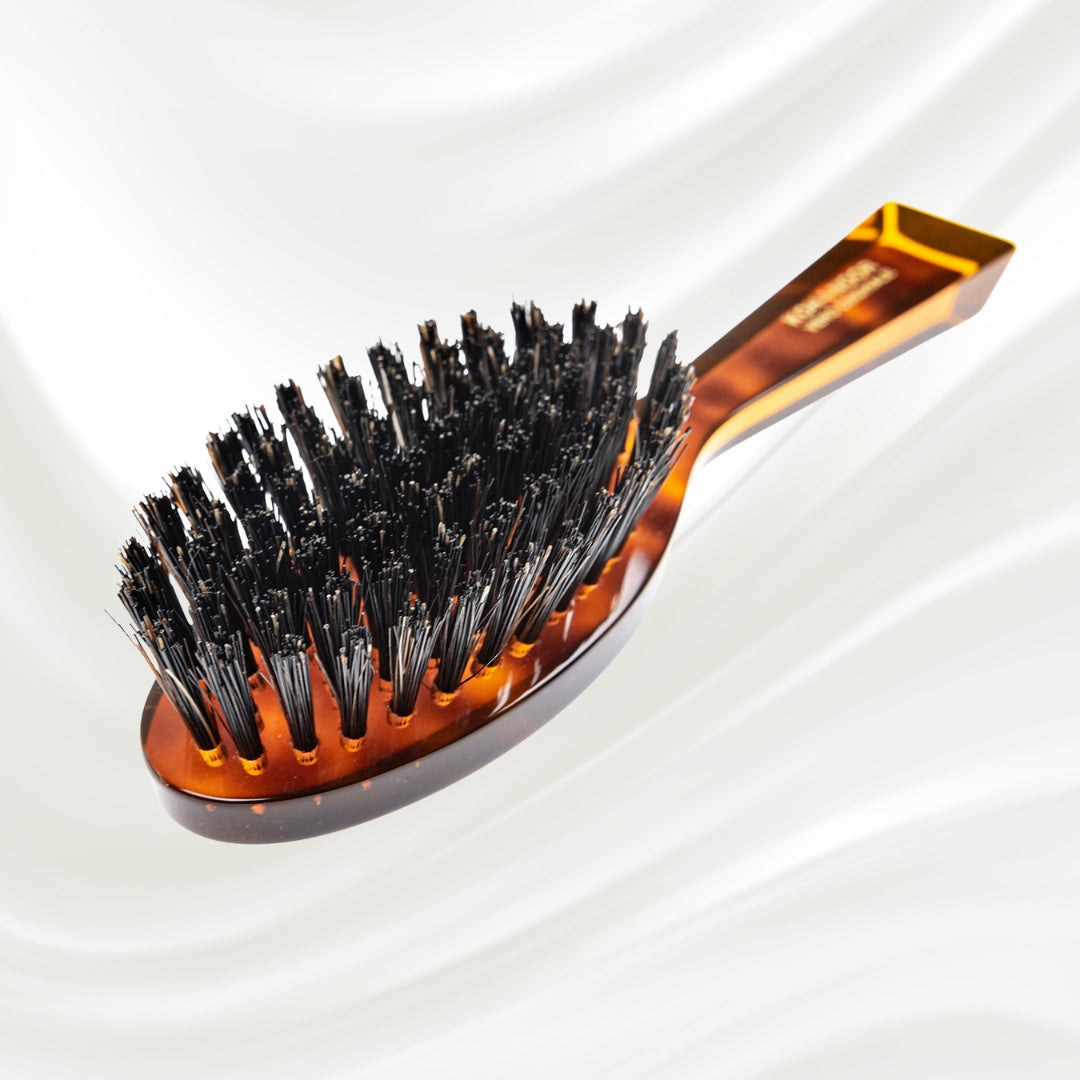 203 KOH-I-NOOR small oval hairbrush with brown tortoiseshell acetate handle and black boar bristles; KOH-I-NOOR's gold logo stamped on the handle