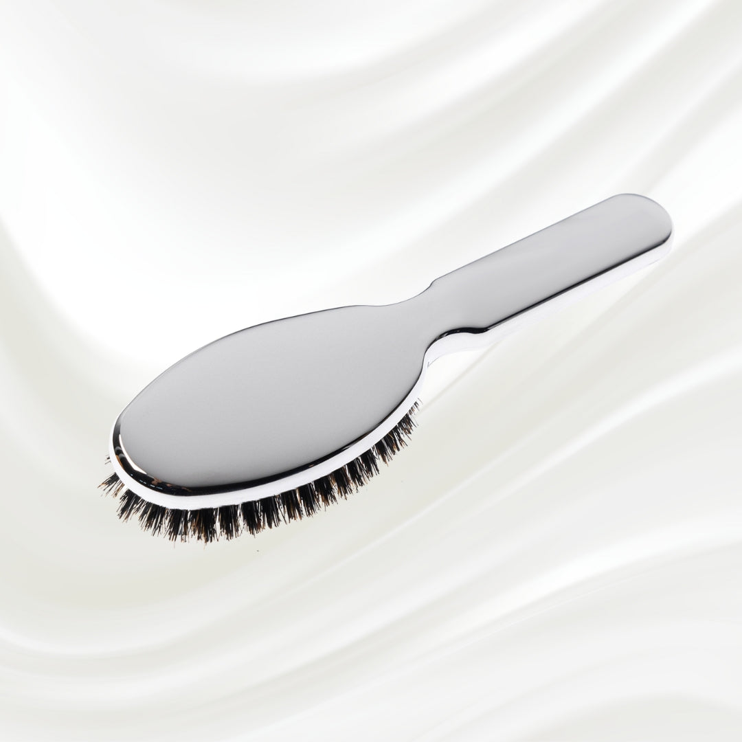 7117KK KOH-I-NOOR Metallic hairbrush with chrome plated handle, and boar and nylon bristles; KOH-I-NOOR's logo stamped on the comb