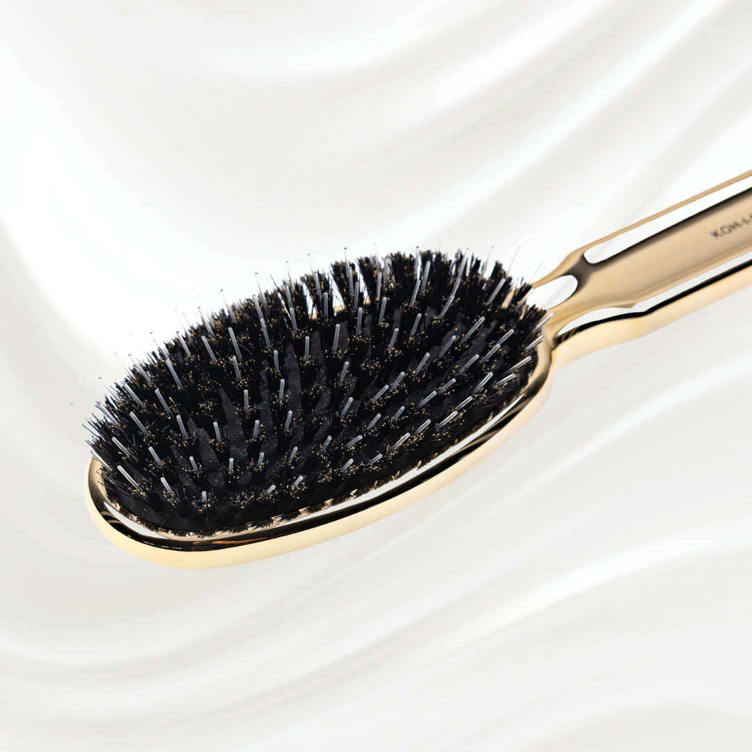7118G KOH-I-NOOR Metallic hairbrush with gold plated handle, and boar and nylon bristles; KOH-I-NOOR's logo stamped on the comb