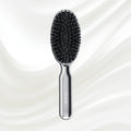 7118KK KOH-I-NOOR Metallic hairbrush with chrome plated handle, and boar and nylon bristles; KOH-I-NOOR's logo stamped on the comb