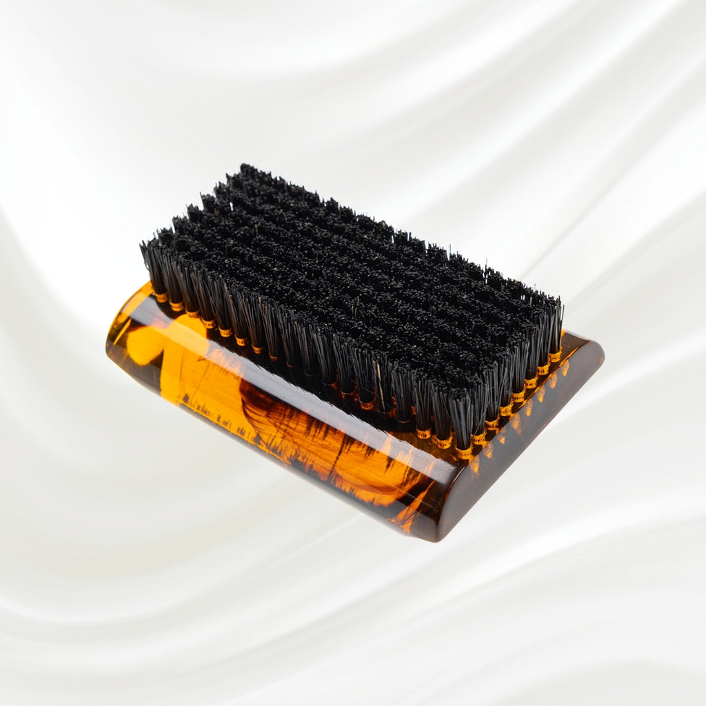 tortoiseshell nail brush with black boar bristle on two sides. KOH-I-NOOR golden logo printed on the side