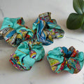 Silk scrunchie Bellagio with light blue cloth and colourful details