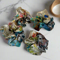 silk scrunchie with bluye and white floral patterns