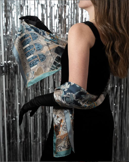 woman with black dress and gloves, and blue silk scarf