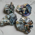 silk scrunchie with geometric patterns, light blue main colour
