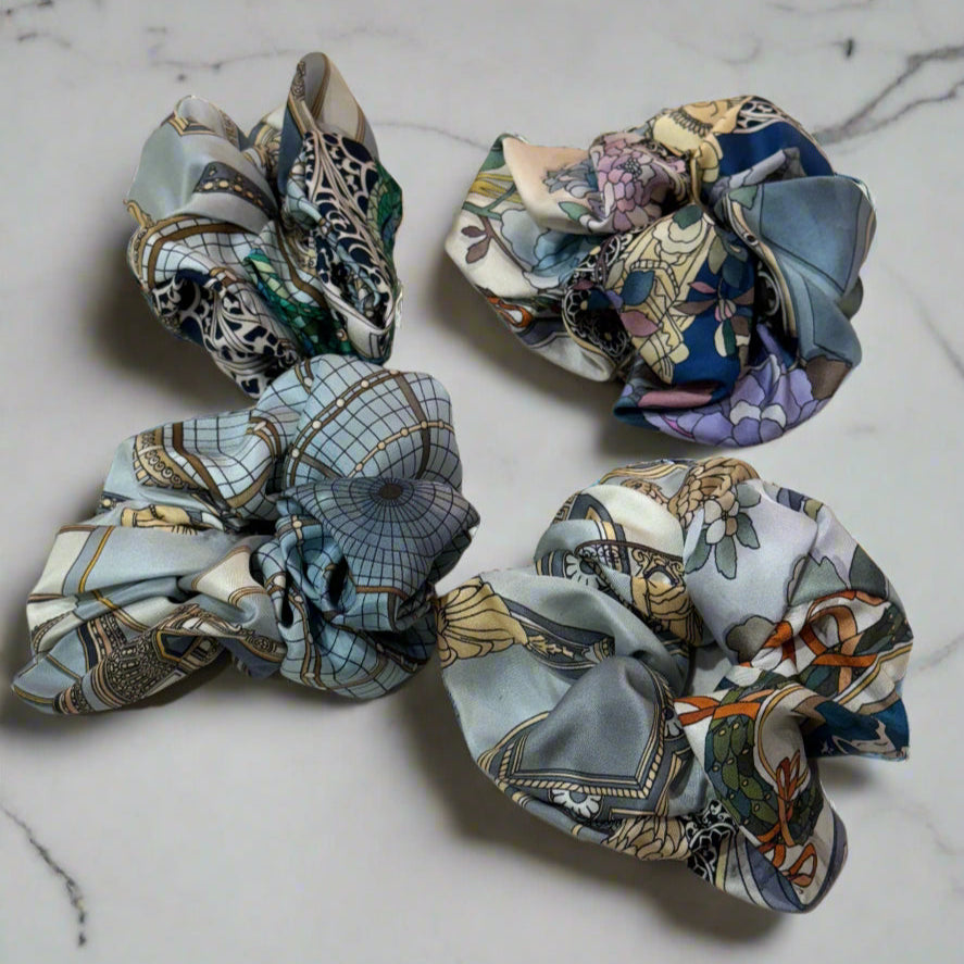silk scrunchie with geometric patterns, light blue main colour