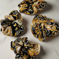 silk scrunchie with gold and black baroque design