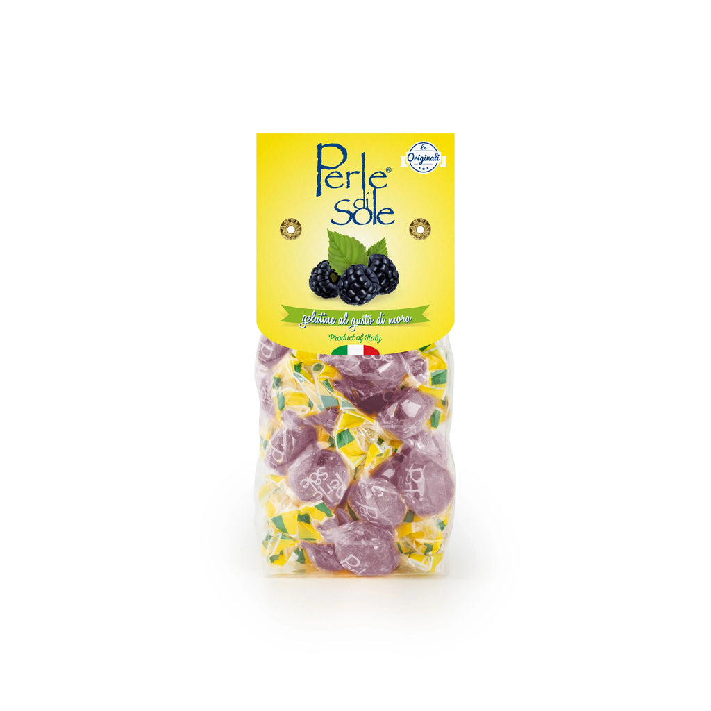 A package of Perle Sole gluten free and vegan blackberry gummy candies, featuring a bright yellow label with blackberry illustrations and a clear bag showing purple gummies inside, set against a plain white background.