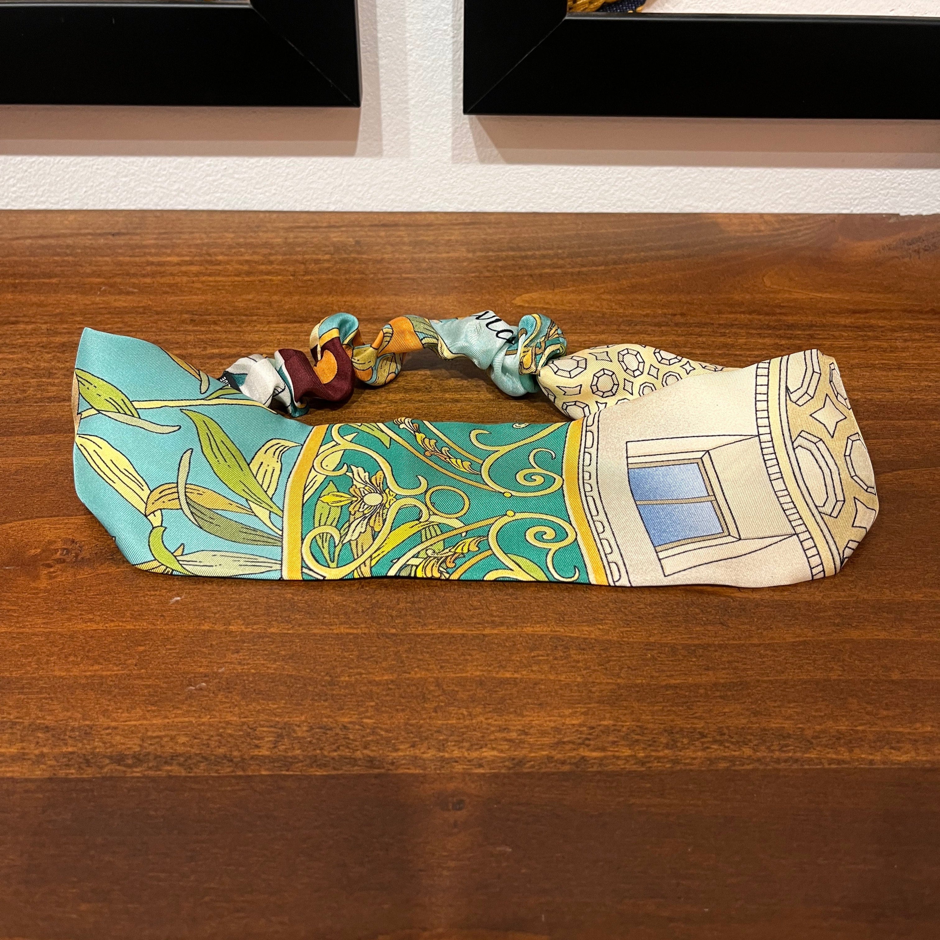 green and white silk headband with architectural design