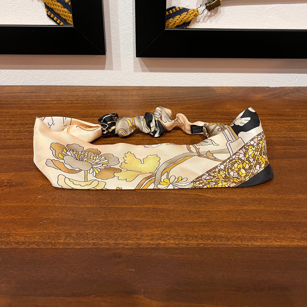 golden silk headband with mosaic and floral design