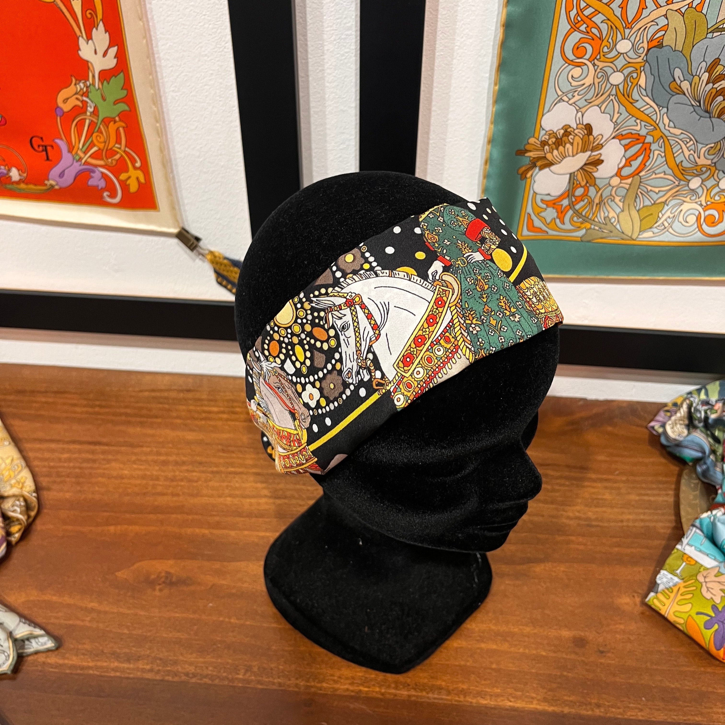black and gold silk headband depicting the Medici family