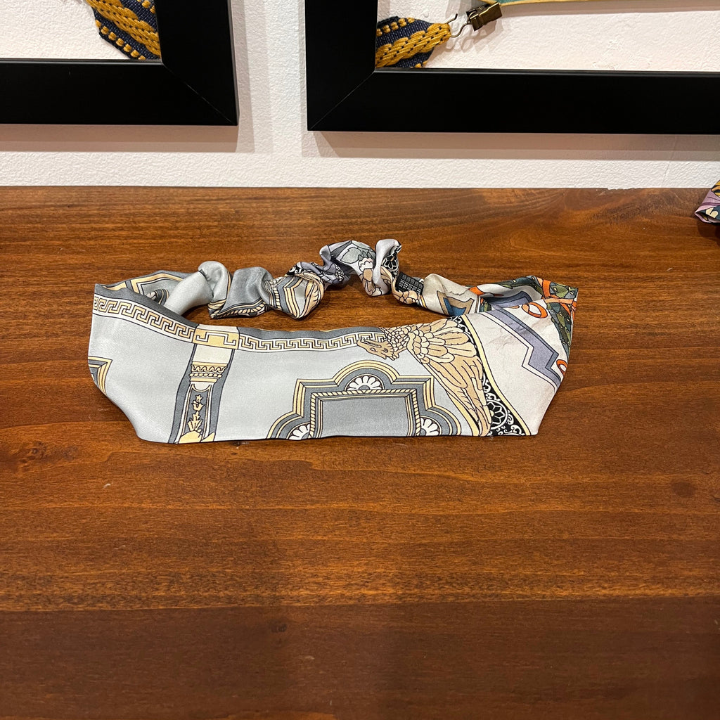 grey and gold silk headband with architectural design