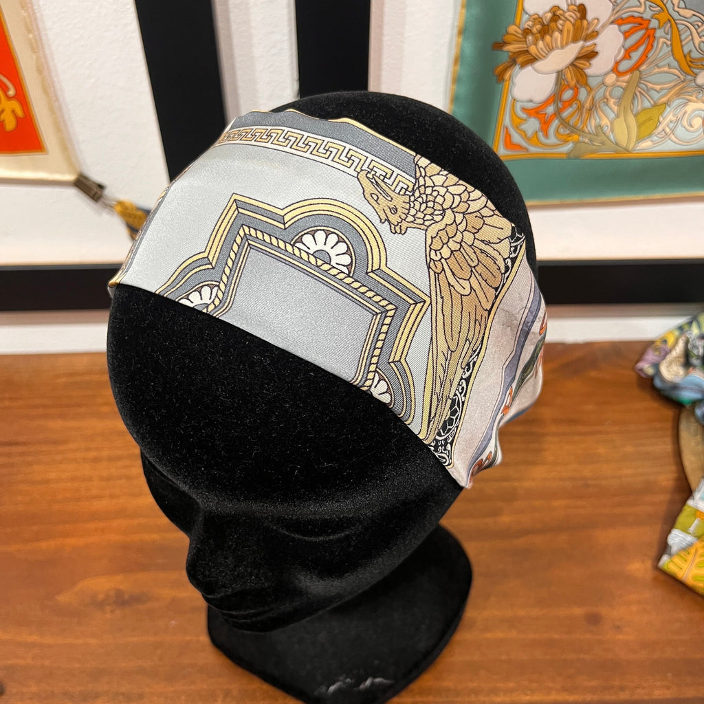 grey and gold silk headband with architectural design