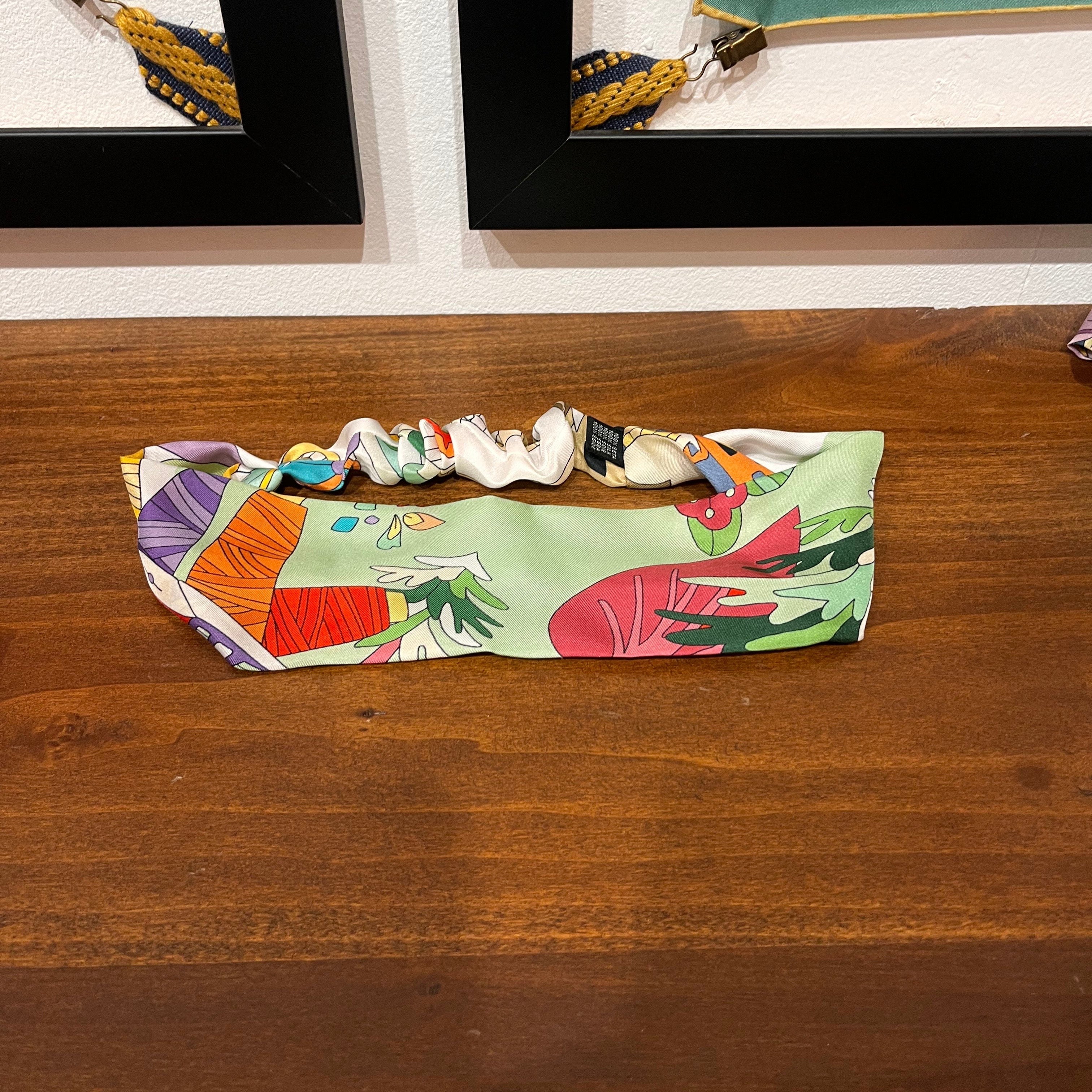 green silk headband with cartoon design