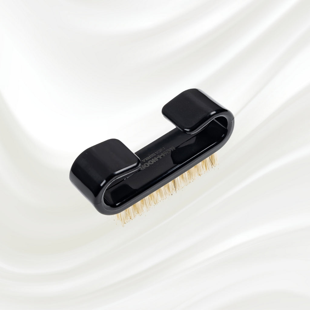 black nail brush with handle and natural bristles. KOH-I-NOOR logo printed on the handle