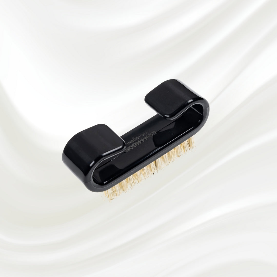 black nail brush with handle and natural bristles. KOH-I-NOOR logo printed on the handle