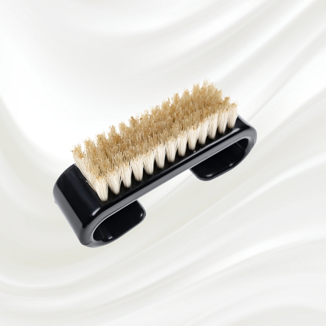 black nail brush with handle and natural bristles. KOH-I-NOOR logo printed on the handle