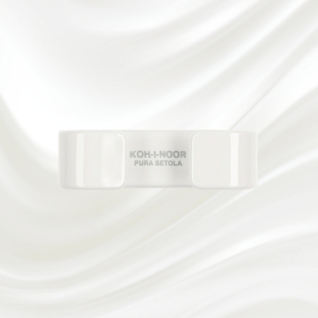 white nail brush with handle and natural bristles. KOH-I-NOOR logo printed on the handle
