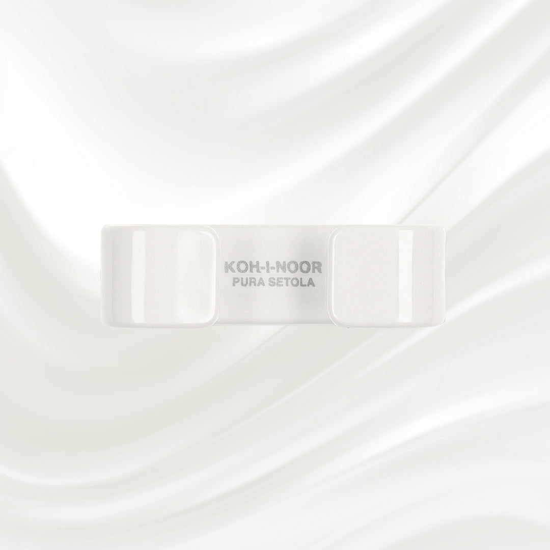 white nail brush with handle and natural bristles. KOH-I-NOOR logo printed on the handle