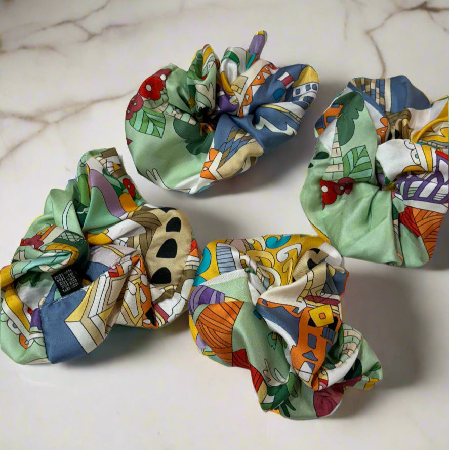 green silk scrunchie with cartoon design of the city of Como