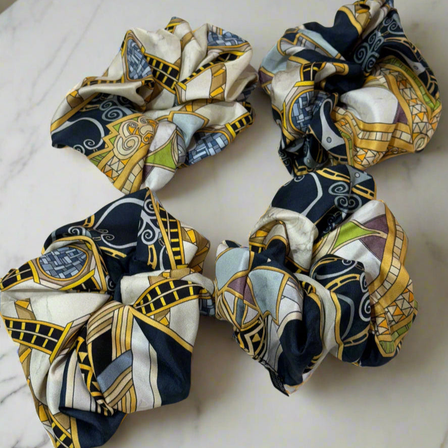 silk scrunchie with white, blue and gold geometric patterns