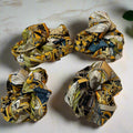 silk scrunchie with yellow floral patterns
