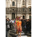 Book cover for 'Made in Italy: Rethinking a Century of Italian Design' showing a fashion runway scene in front of a large historic cathedral, with a model in an orange dress walking down the catwalk and onlookers on both sides.