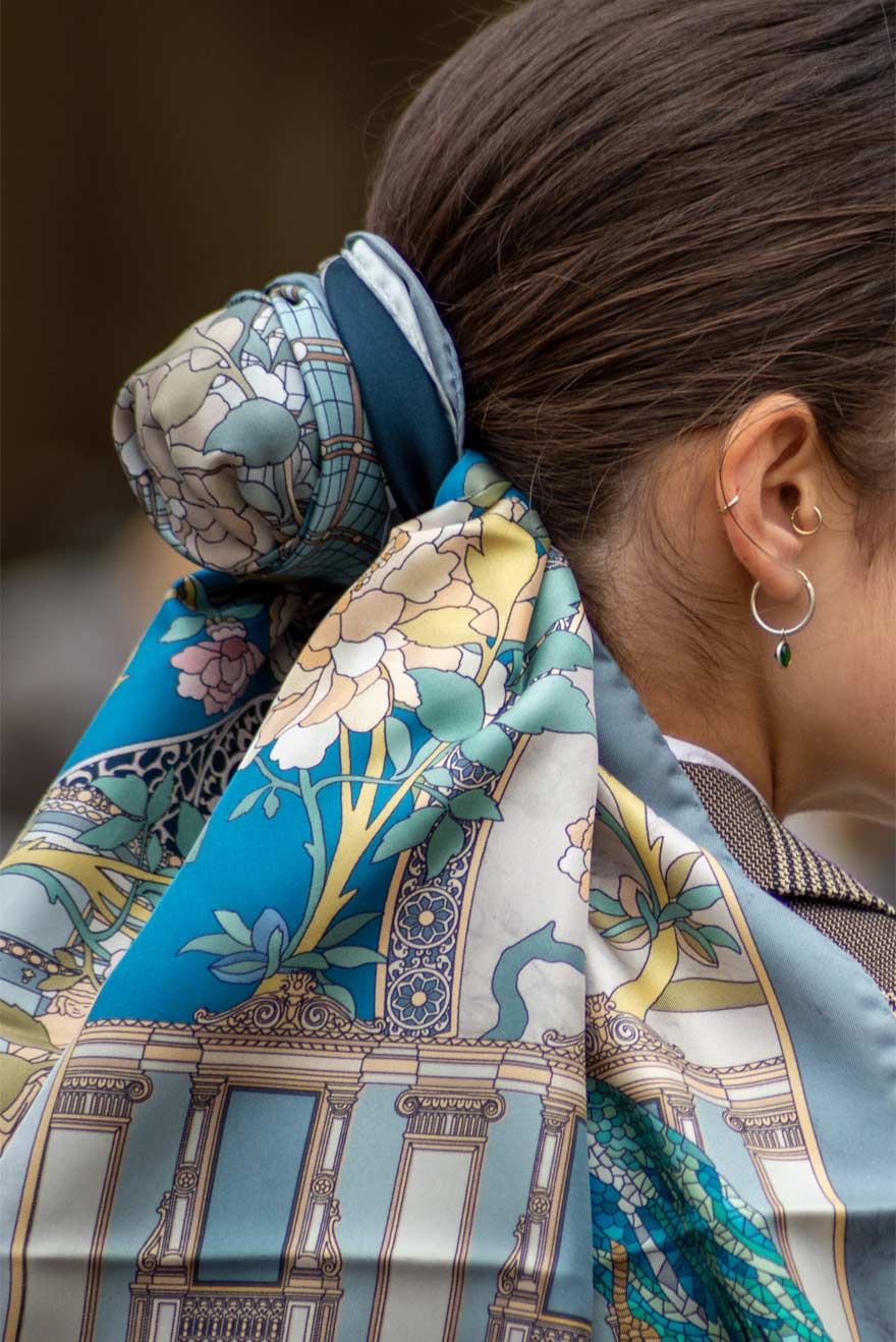 woman wearing blue silk scarf as hair accessory
