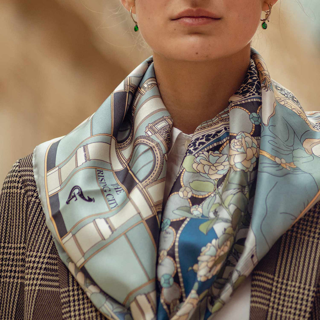 woman wearing a blue silk scarf around her neck