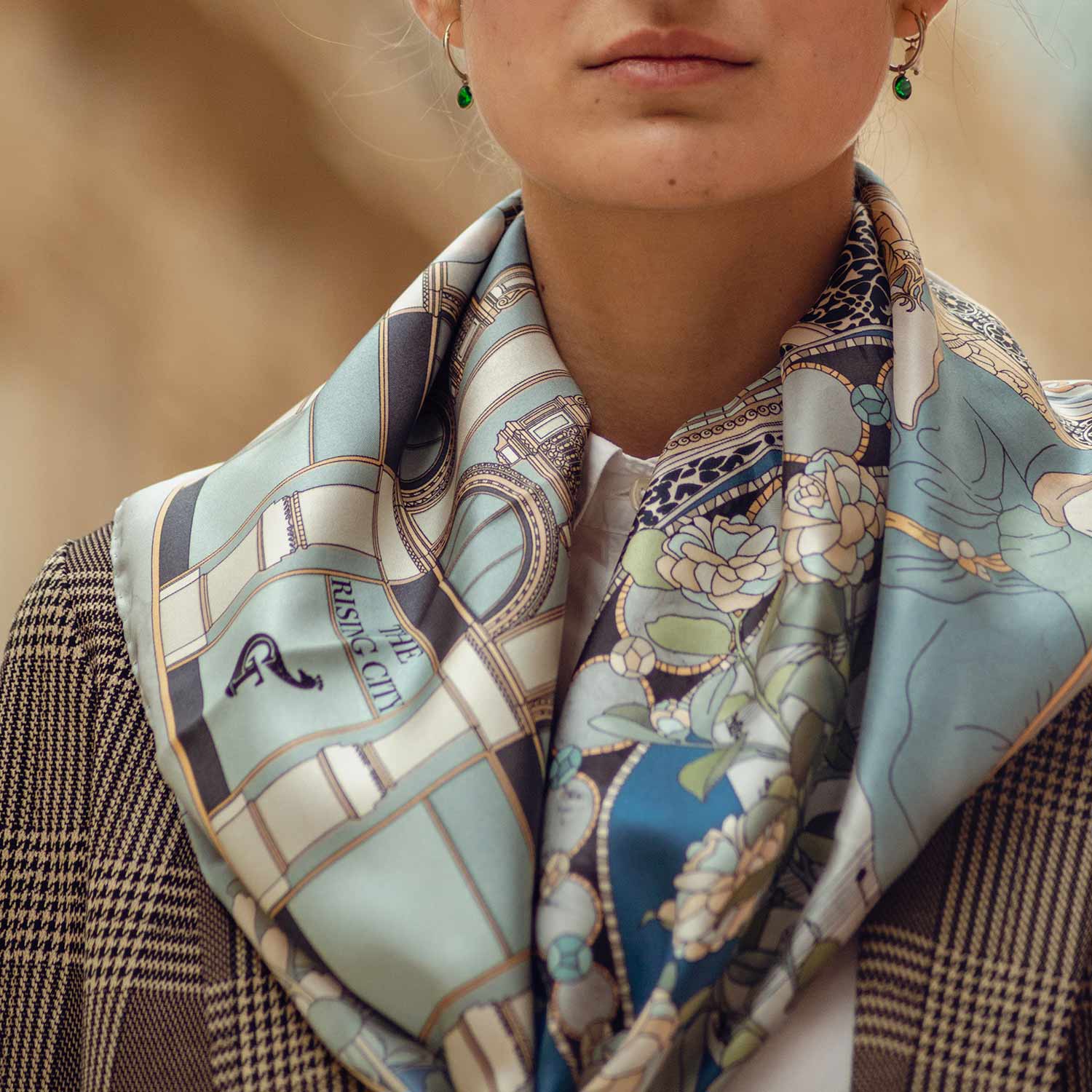 woman wearing a blue silk scarf around her neck