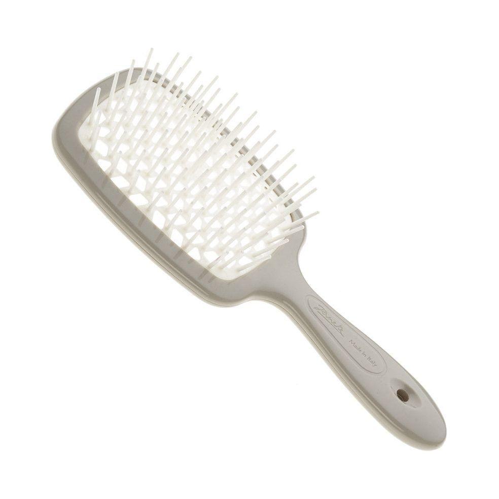 Gray detangling brush on a white background