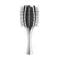 A sleek, metallic silver paddle hairbrush with dark gray bristles, centered against a solid dark green background.