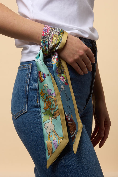 silk twilly knotted on a girls wrist