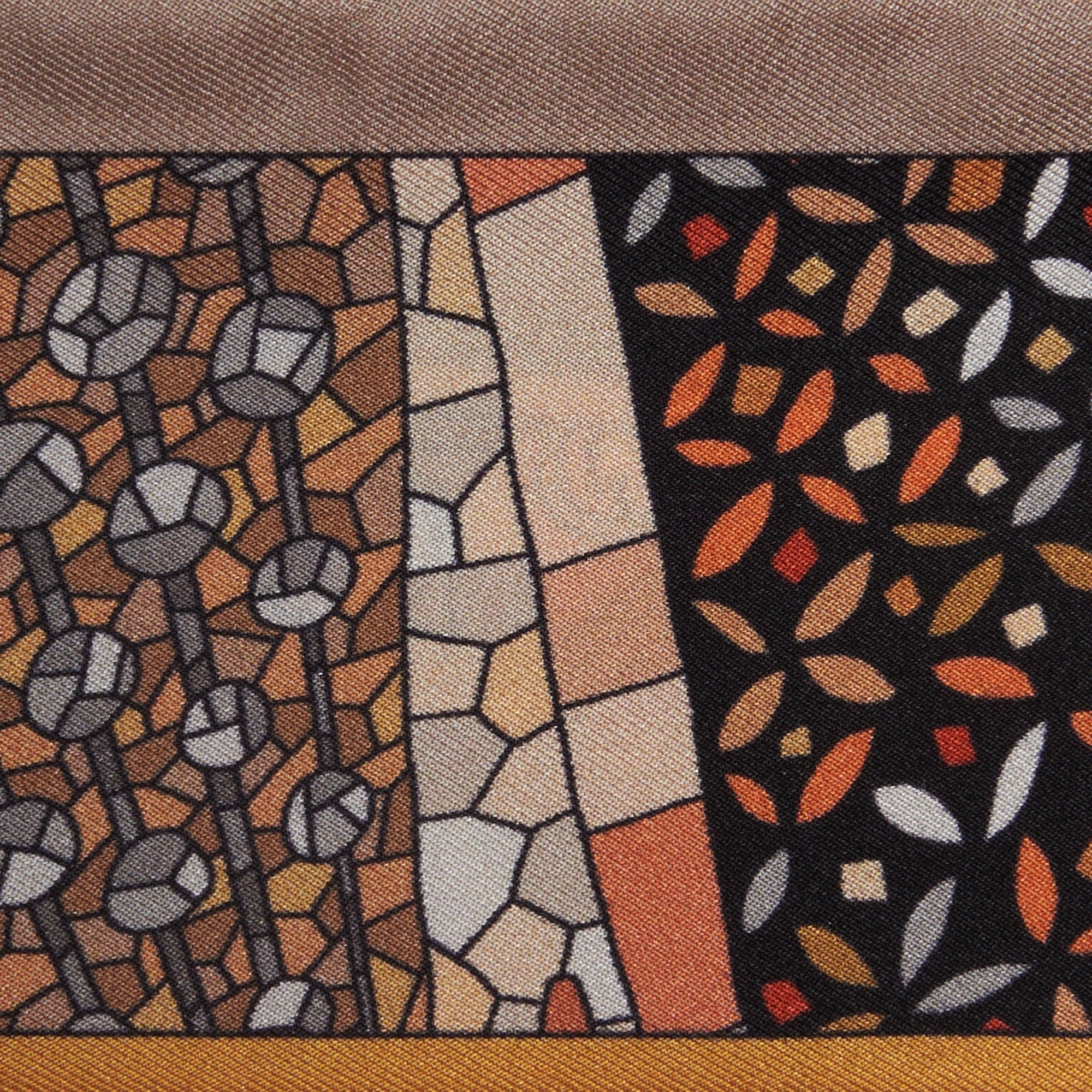 artistic patterns on a gold and orange silk twilly