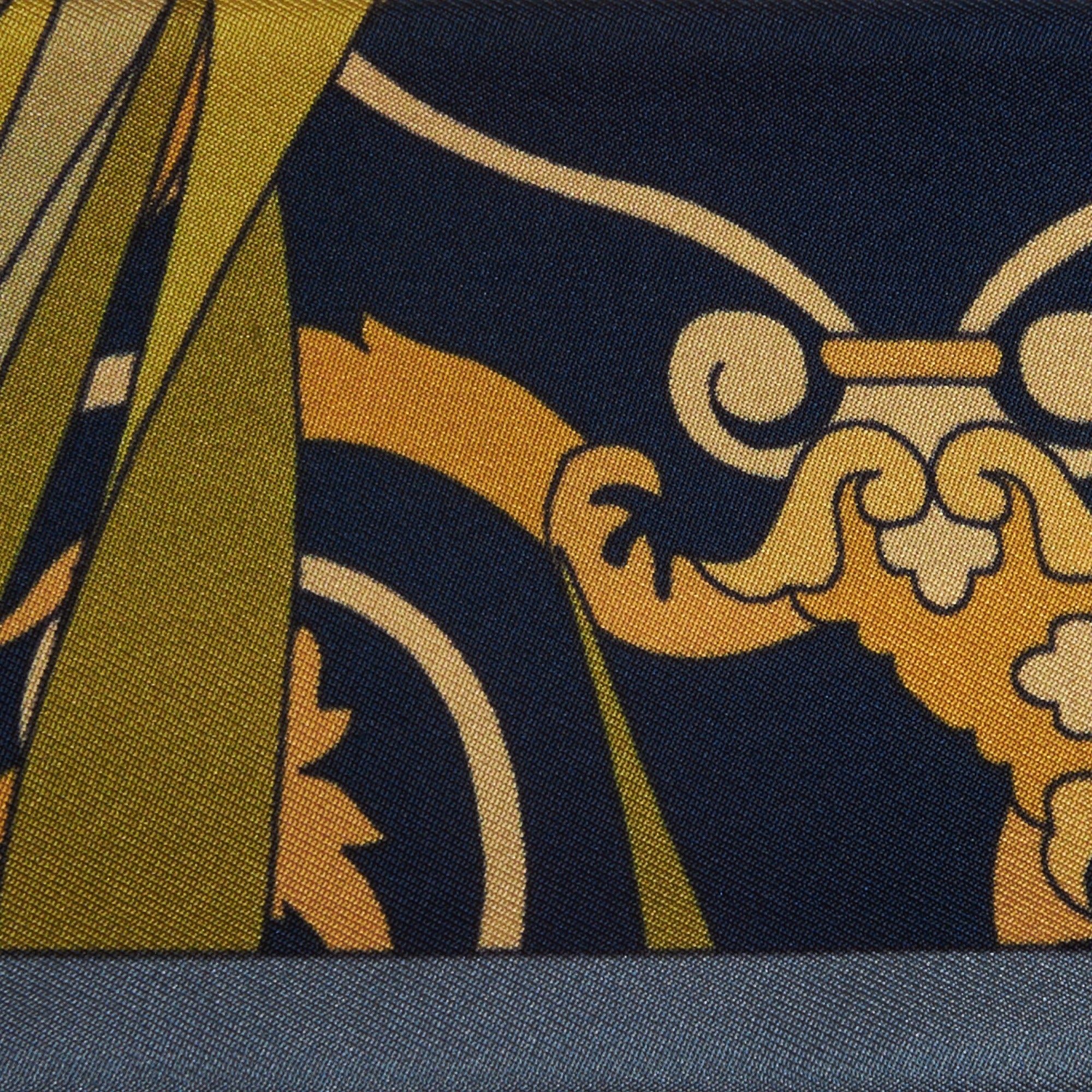 gold decorations on a blue silk twilly